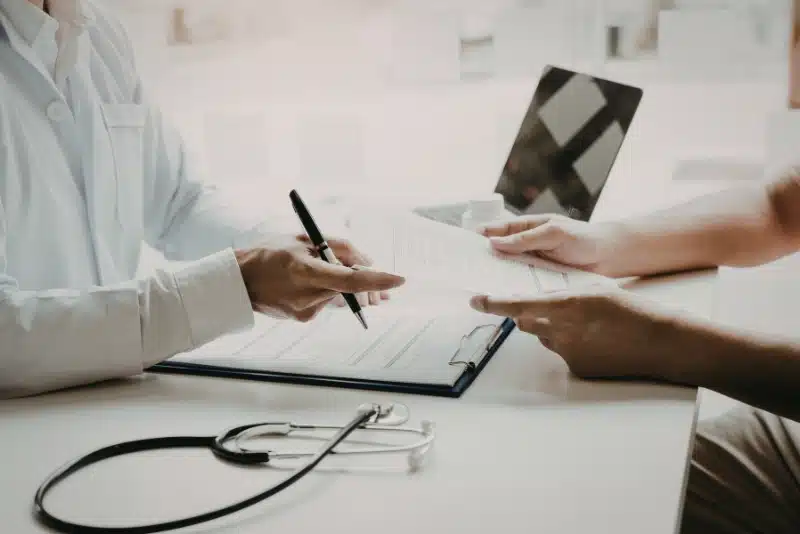 Employee reviewing a severance agreement with an employment lawyer