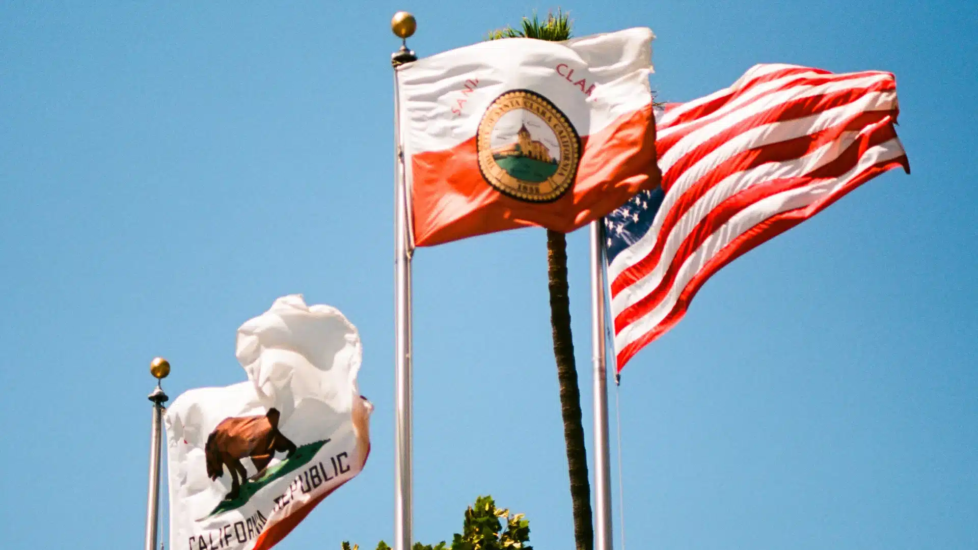 Santa Clarita, California city with suburban neighborhoods, rolling hills, and mountain views under a clear sky.
