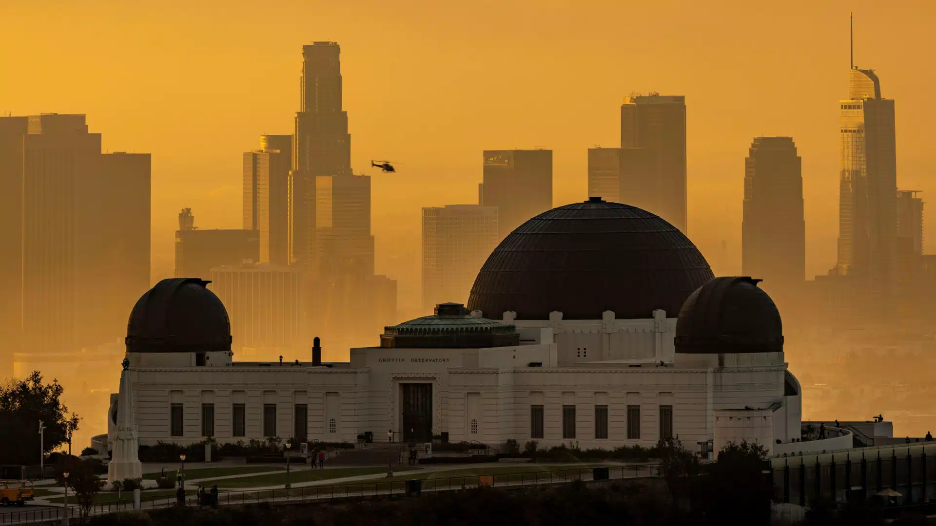 Employee signing documents while lawyer provides advice on compensation and rights.