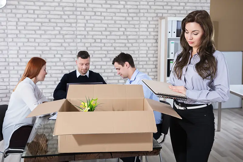 Person discussing severance agreement terms with attorney before finalizing